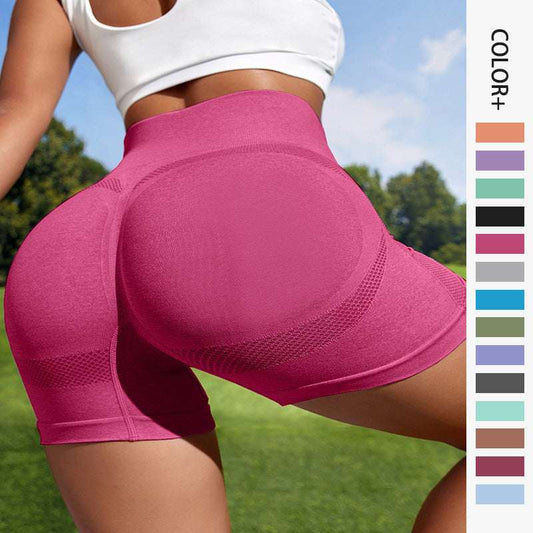 Pink athletic shorts with a person wearing them outdoors, color swatches on the side.